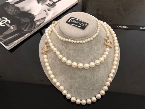 replica signature chanel pearls|Chanel knock off necklace.